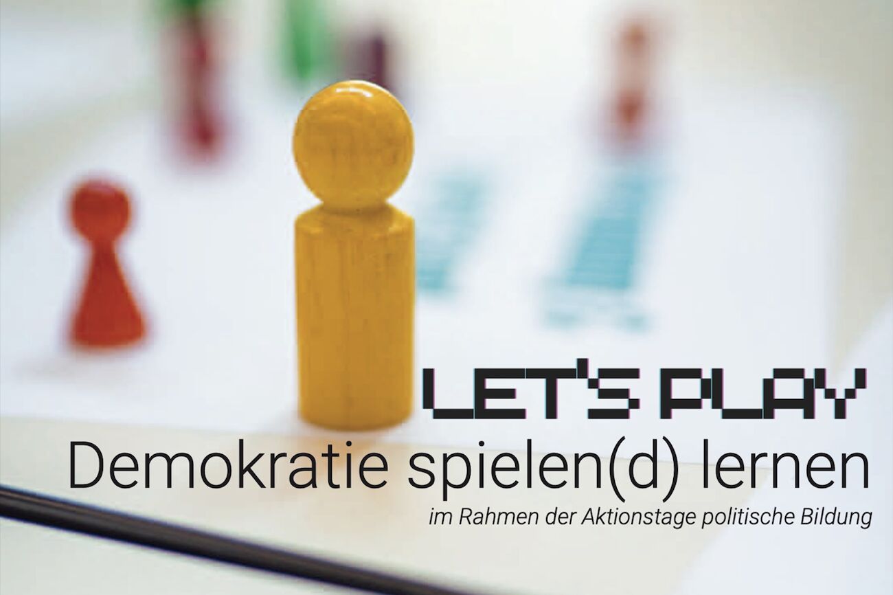 Dekorativbild: Einladung zum Aktionstag mit einem Spielwürfel