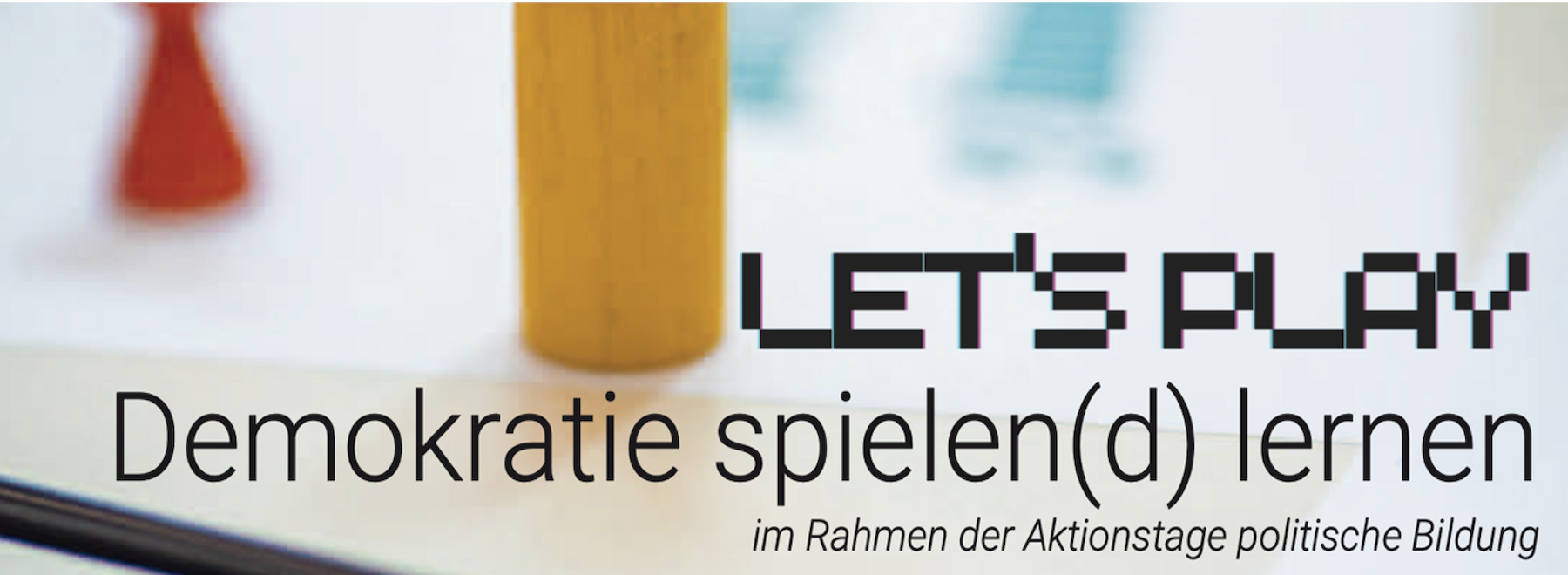 Dekorativbild: Einladung zum Aktionstag mit einem Spielwürfel